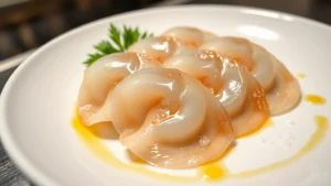 Fresh abalone sashimi arranged on white ceramic plate with sesame oil drizzle and sea salt crystals, minimalist plating, close-up macro photography showing translucent flesh and natural iridescent sheen, professional culinary styling, restaurant kitchen lighting